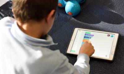 A child using a tablet Description automatically generated with medium confidence